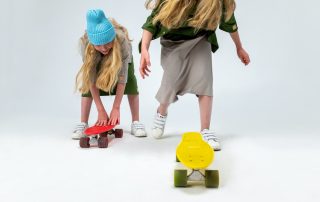 Twins with skateboards, expressing their individual personalities and highlighting the importance of tailored storytelling