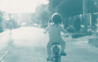 Child embarking on a cycling adventure, symbolizing the fearless start and journey into the world of marketing for startups and SMEs